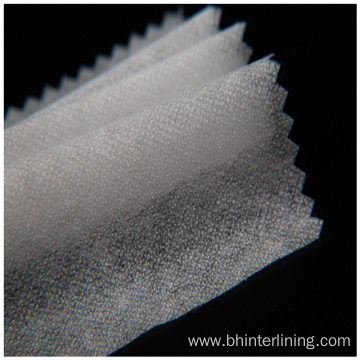 Soft and smooth feeling fusible nonwoven interlining fabric